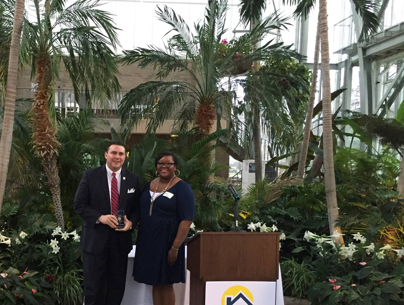 CDA Alana Green, Executive Director of CDA, presenting Mike McMillan, CEO of the Urban League with the 2016 Community Advocate of the Year Award